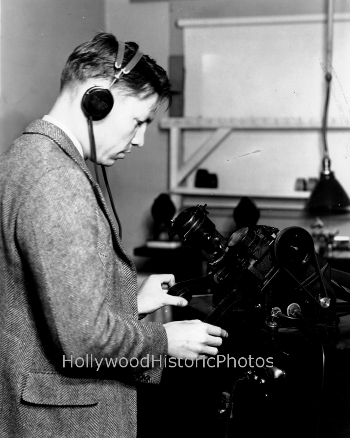 Portable sound recording unit. Editor listening to dialogue on early movieola editing mach. 1930 Paramount.jpg